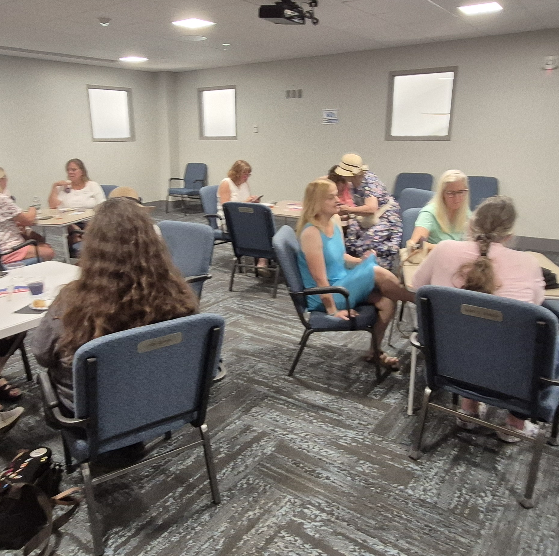 Patrons enjoying their tea and snacks in the Meeting Room.