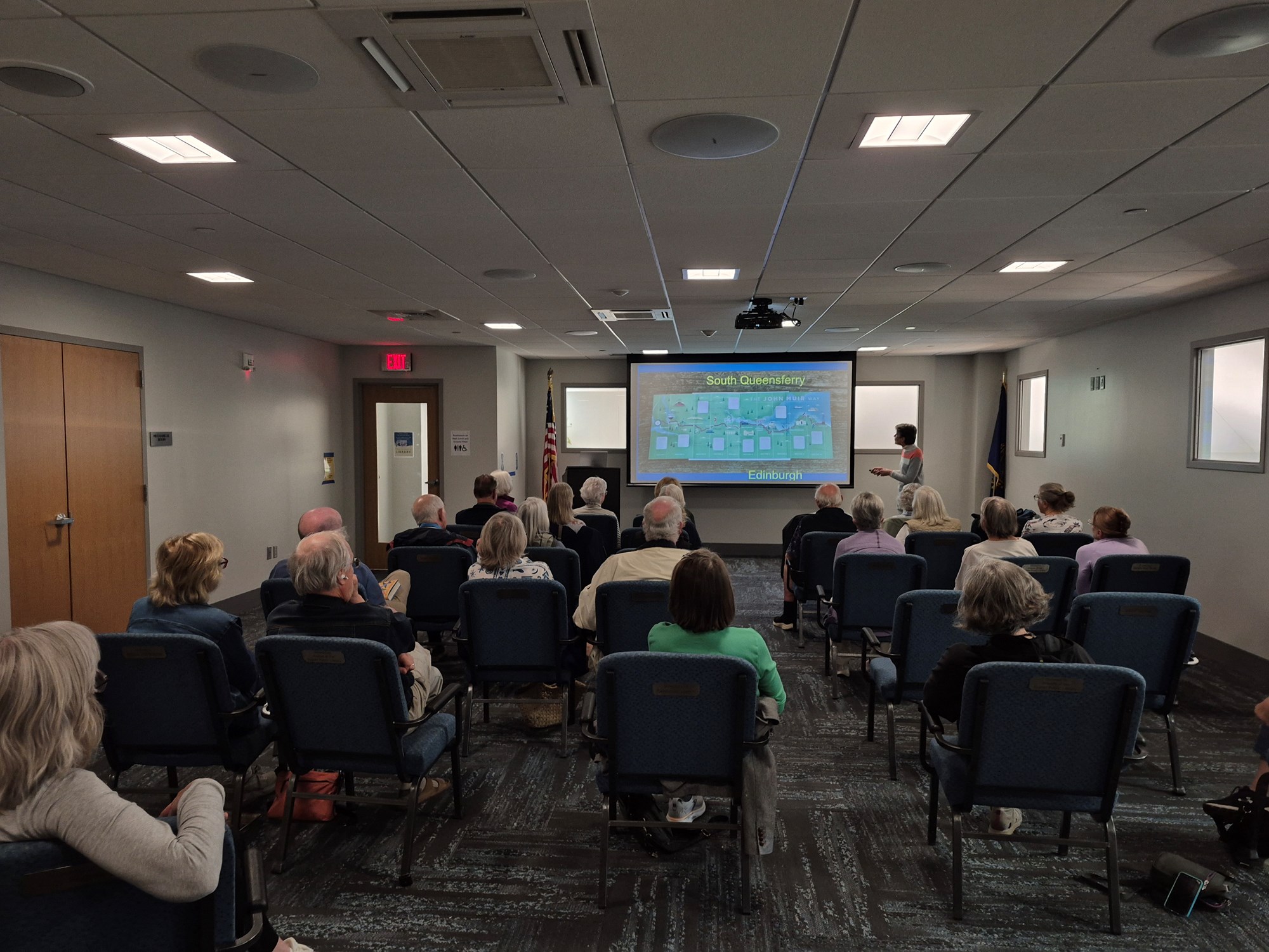3 of 4: Gale Carey presenting in the Meeting Room.