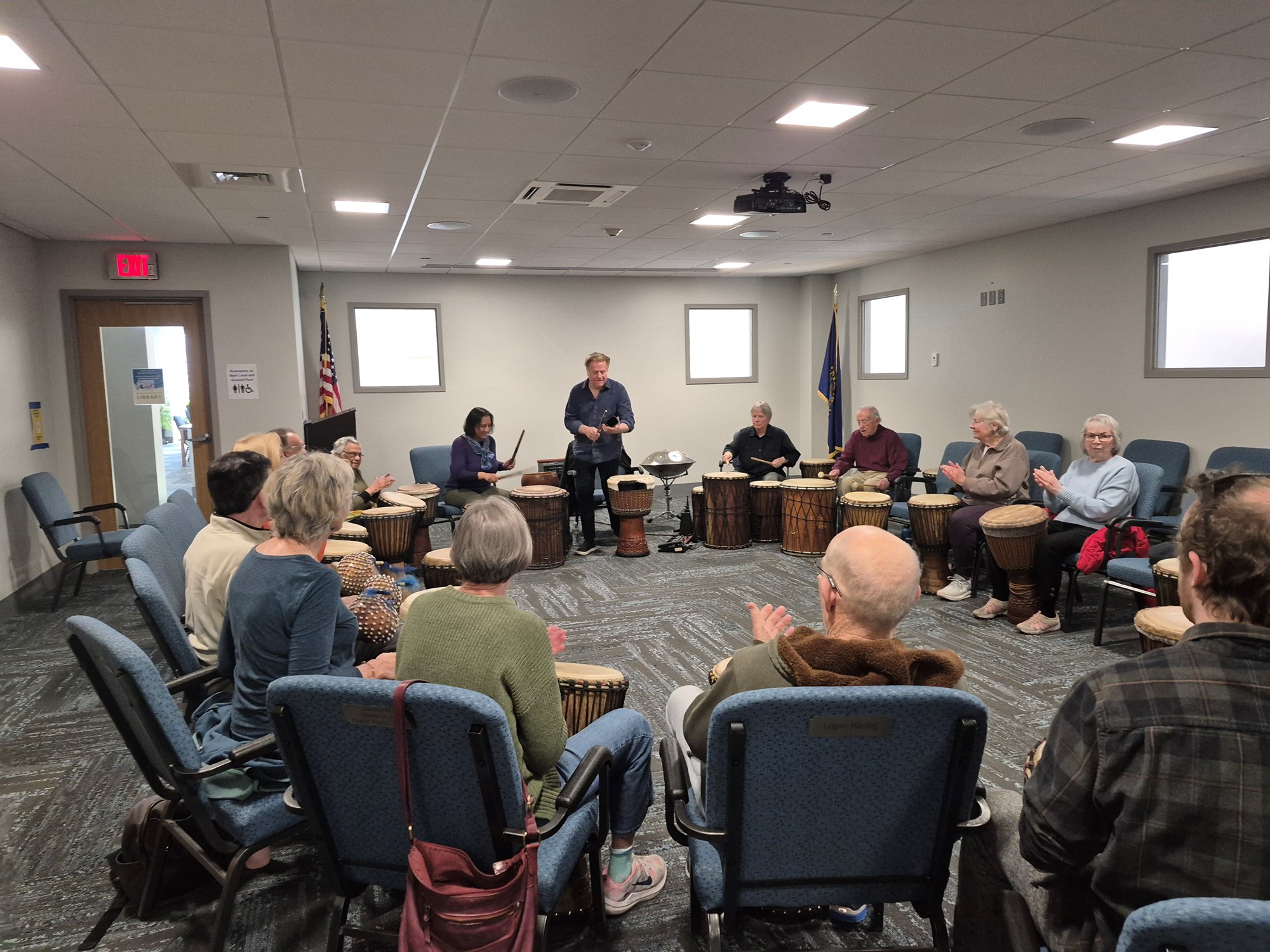 Randy Armstrong guiding patrons through the drumming session in the Meeting Room.