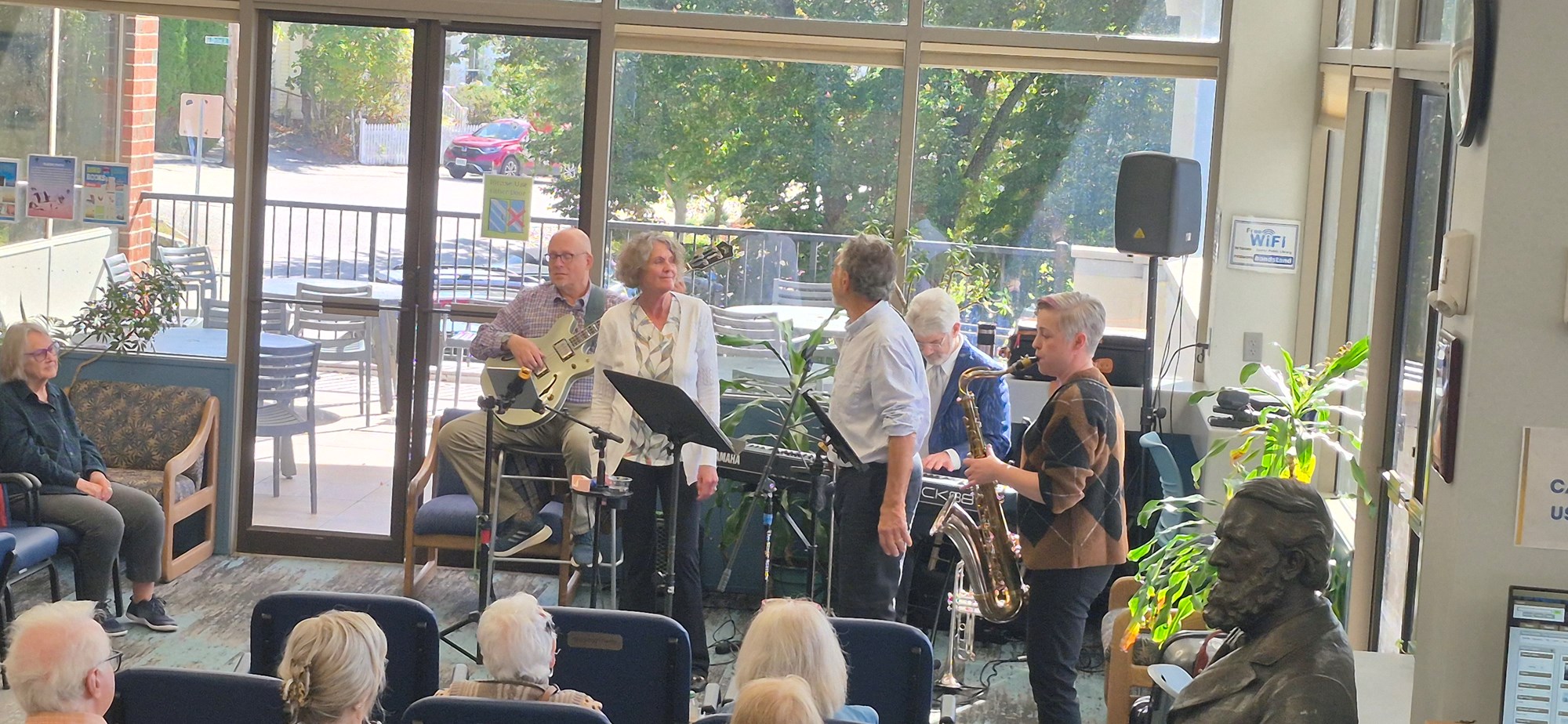 Now's the Time performing in the Main Seating area of the library.