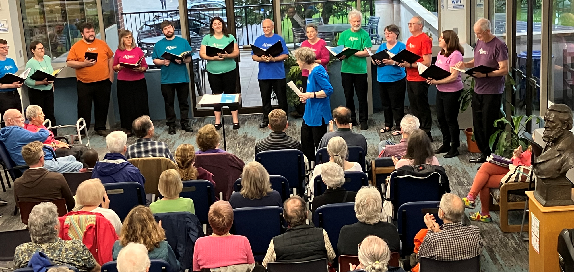 Poco Amare performing in the main seating area of the library.