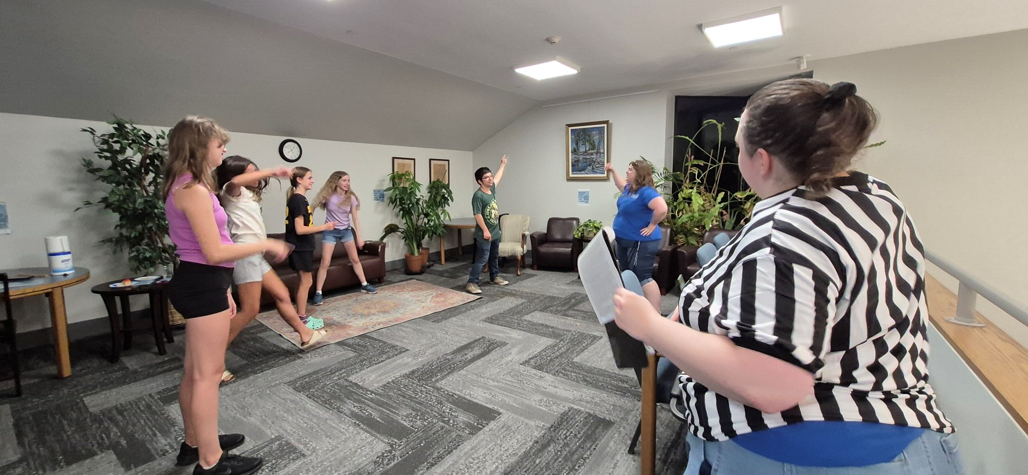 Teens playing "Simon Says" (aka "Sarah Says") during the Library Lock-In.
