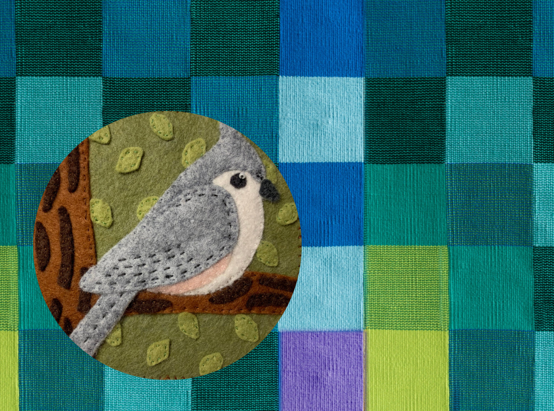 Photograph of various colored yarn stacked on top of one another