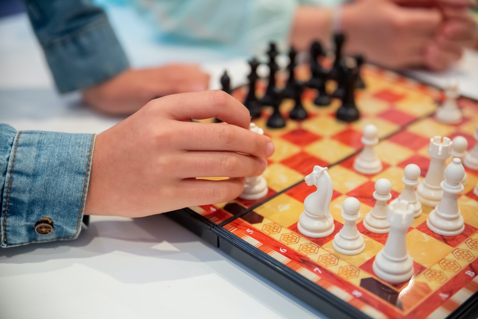 Two People Playing the Chessboard