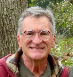 white man with gray hair smiling