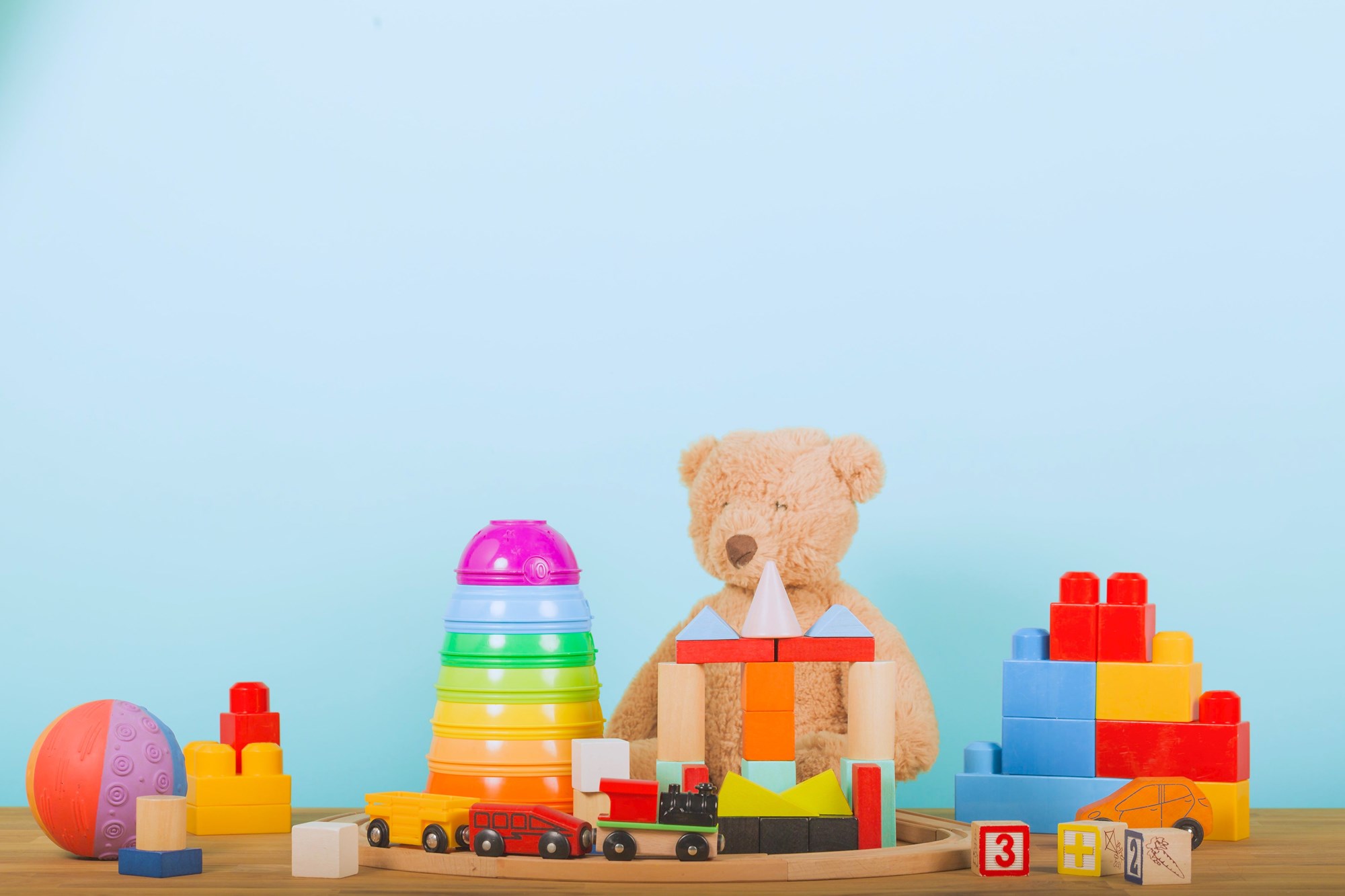 Childrens Toys on Blue Background
