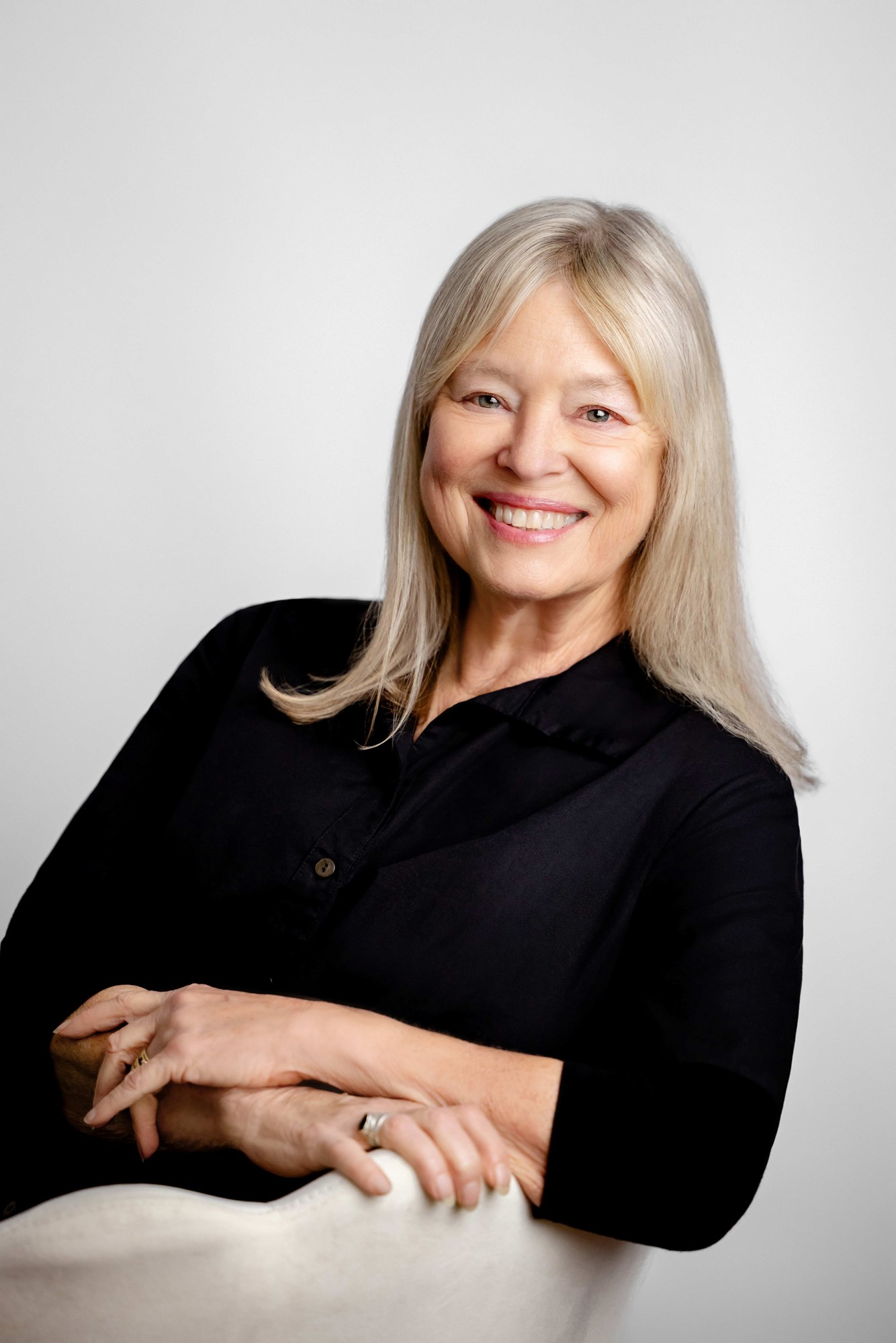 white woman with blonde hair and black shirt