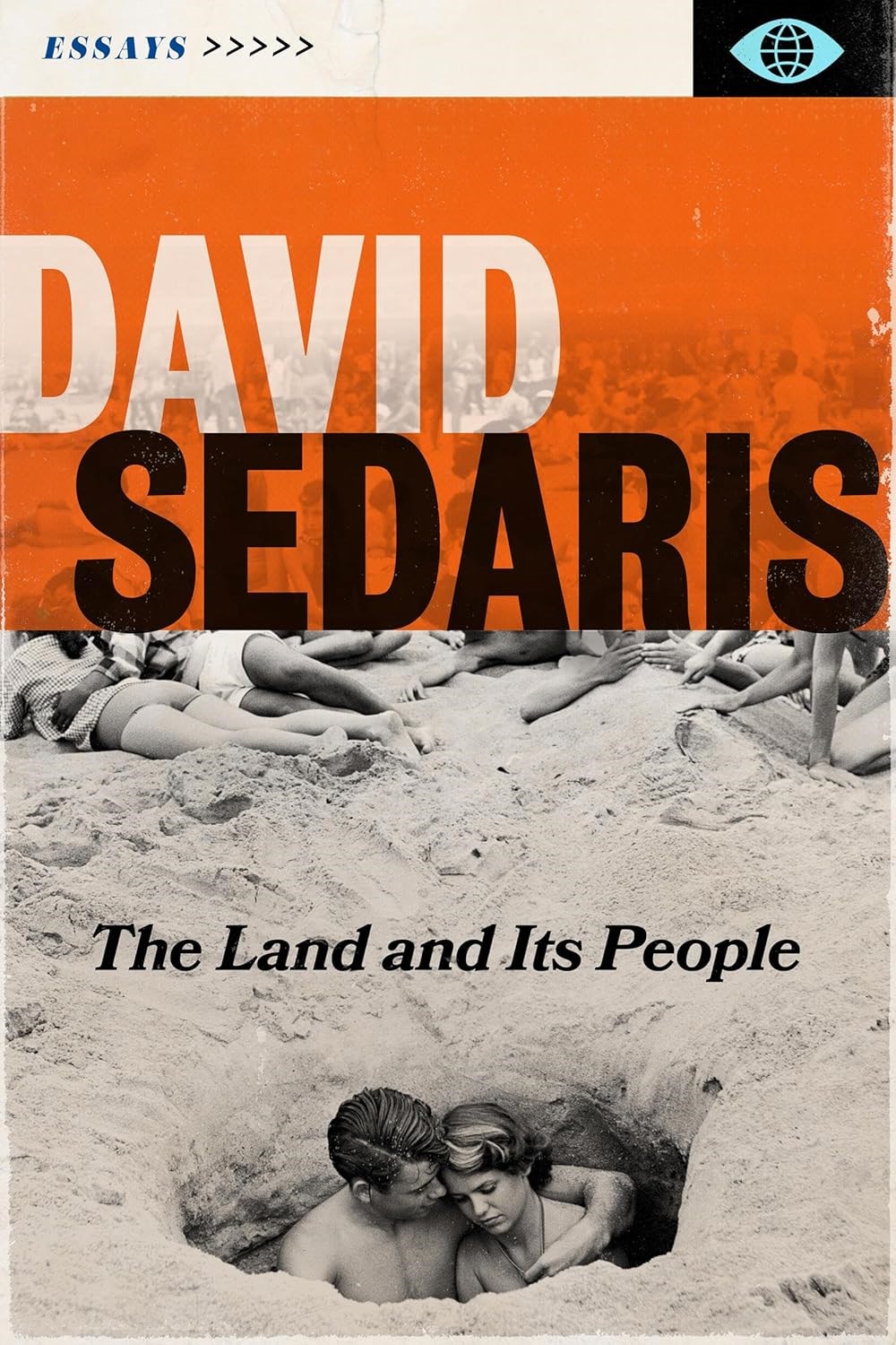 two people standing in a hole dug in the sand