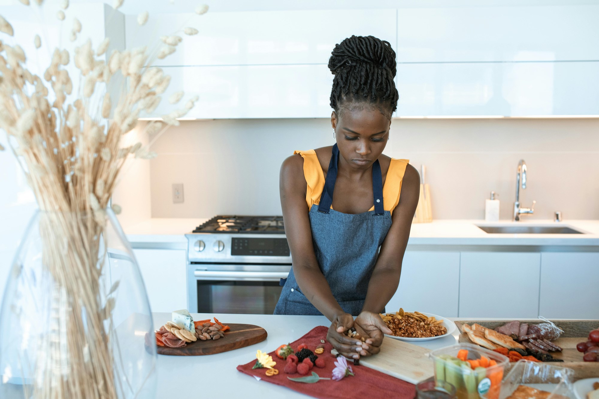 A Woman Preparing a Charcuterie Board