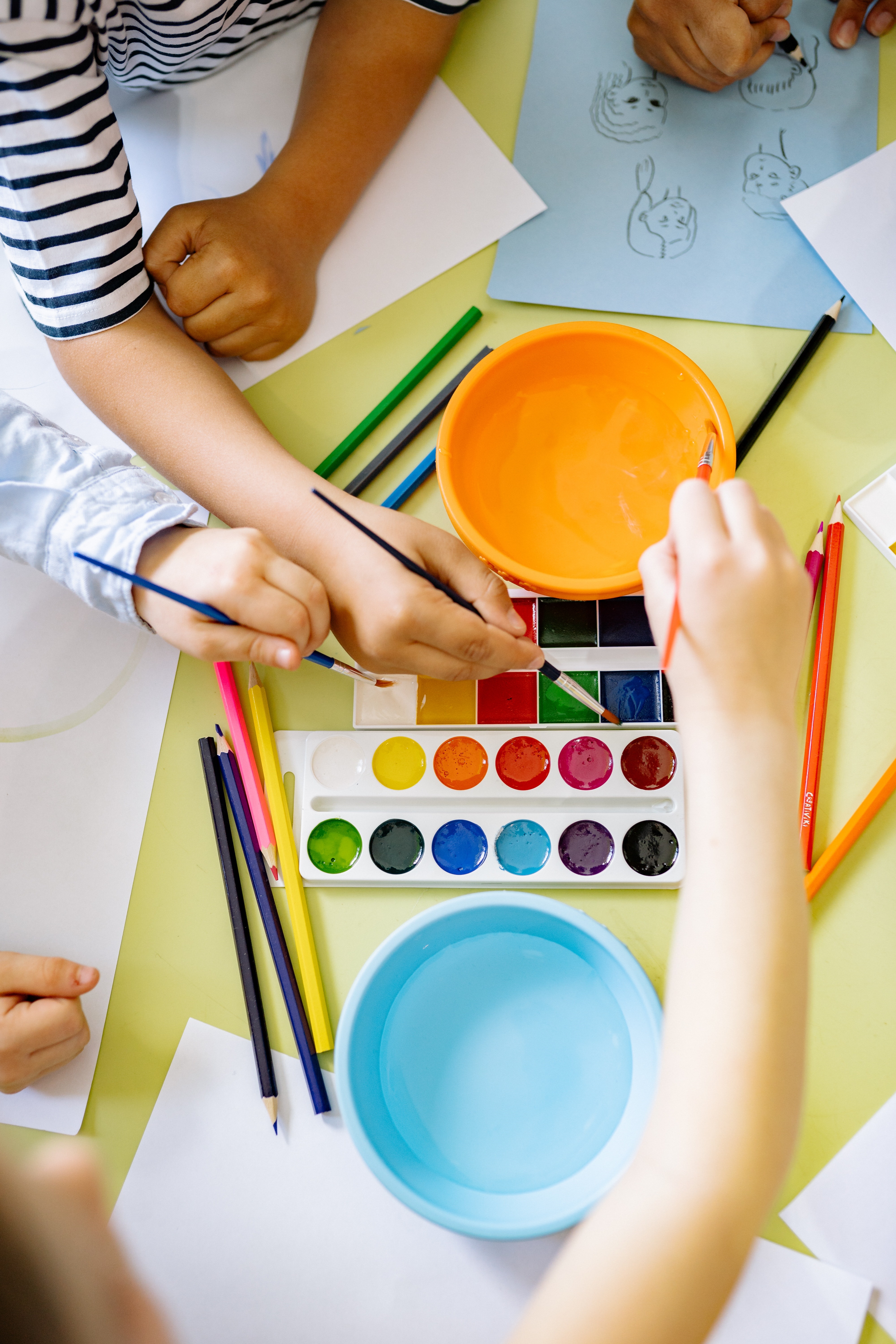Group of Kids Painting at a Table