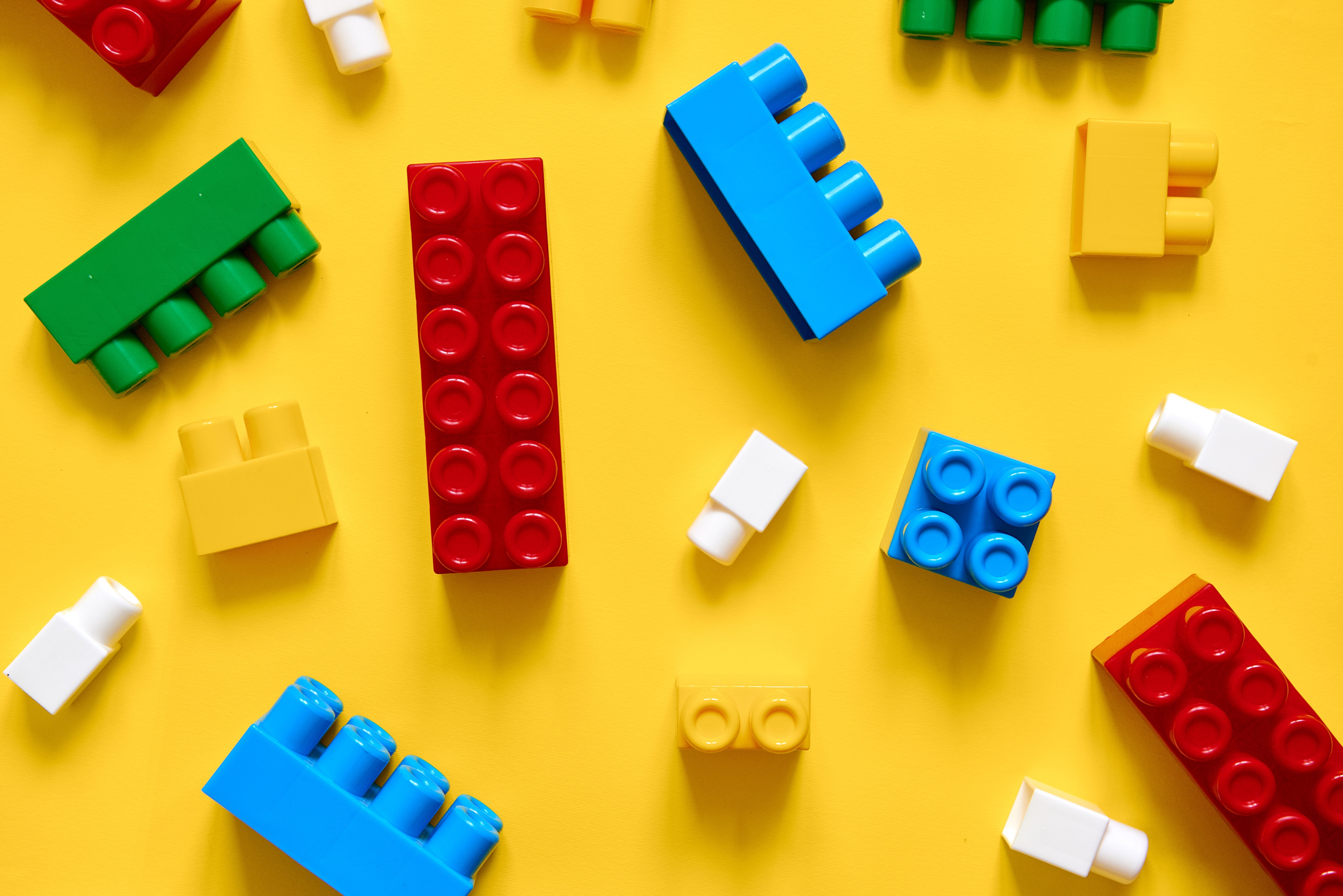 Colorful Toy Blocks On Yellow Background