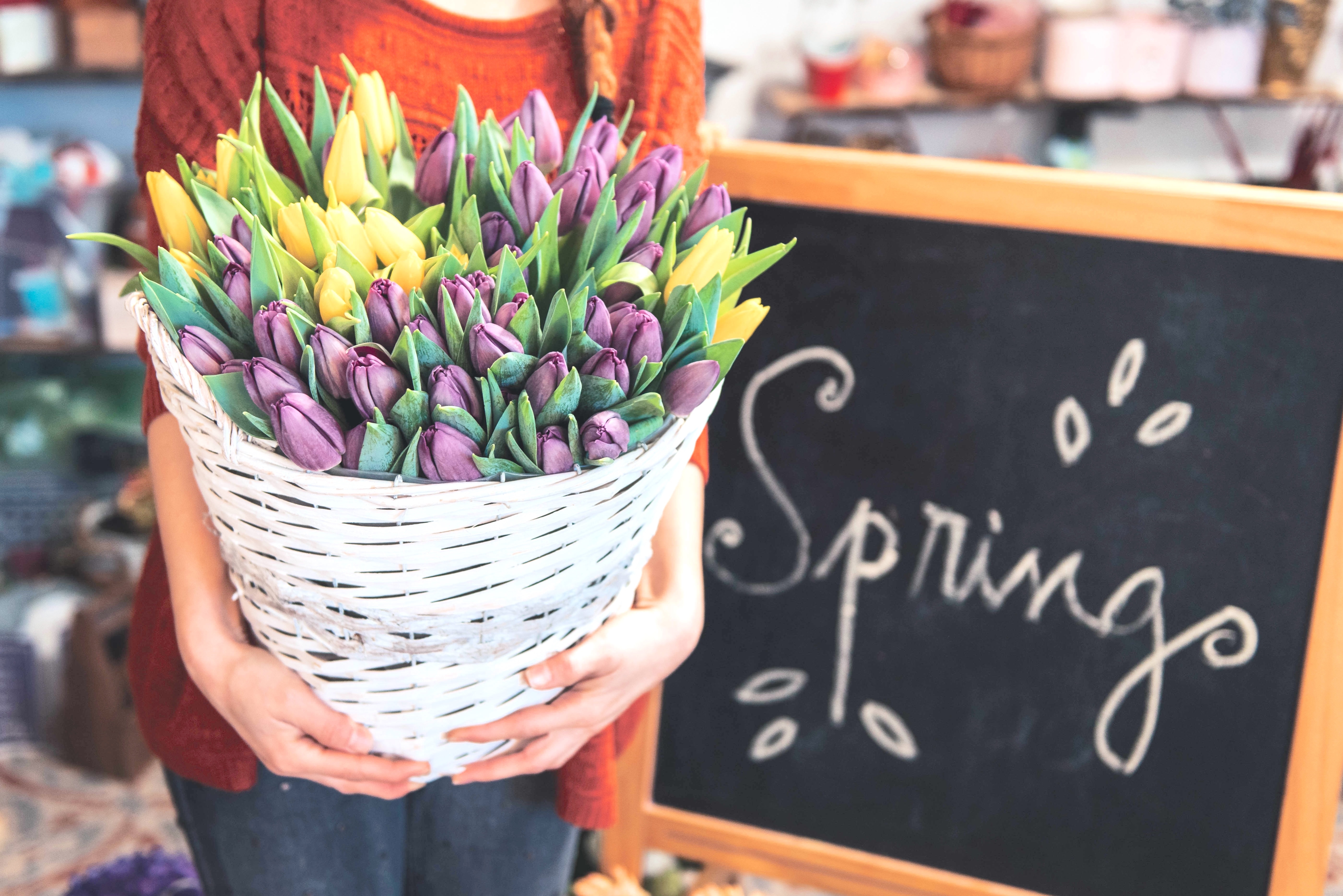 Woman Holding Basket of Flowers