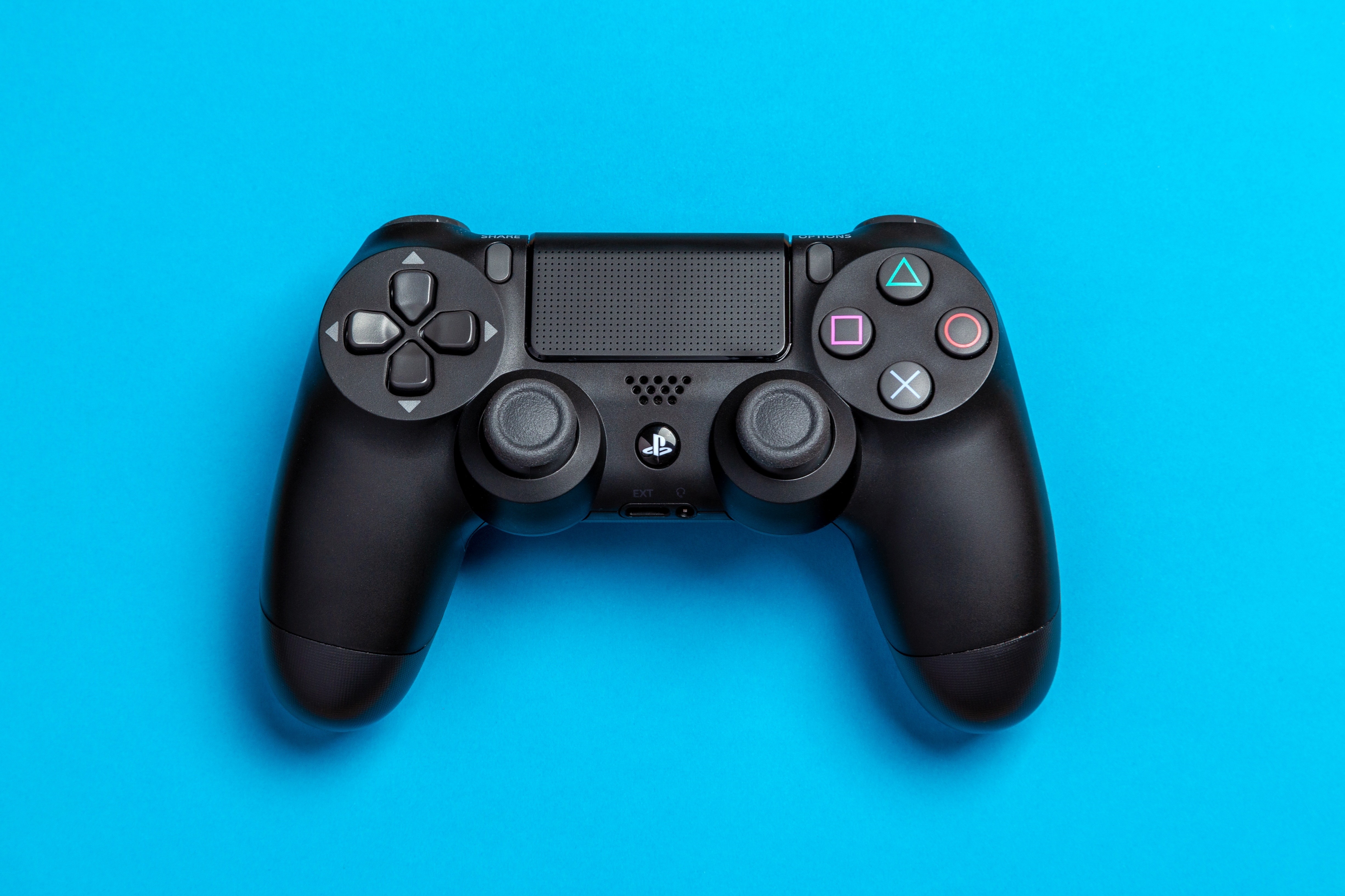 Video Game Controller on Blue Background