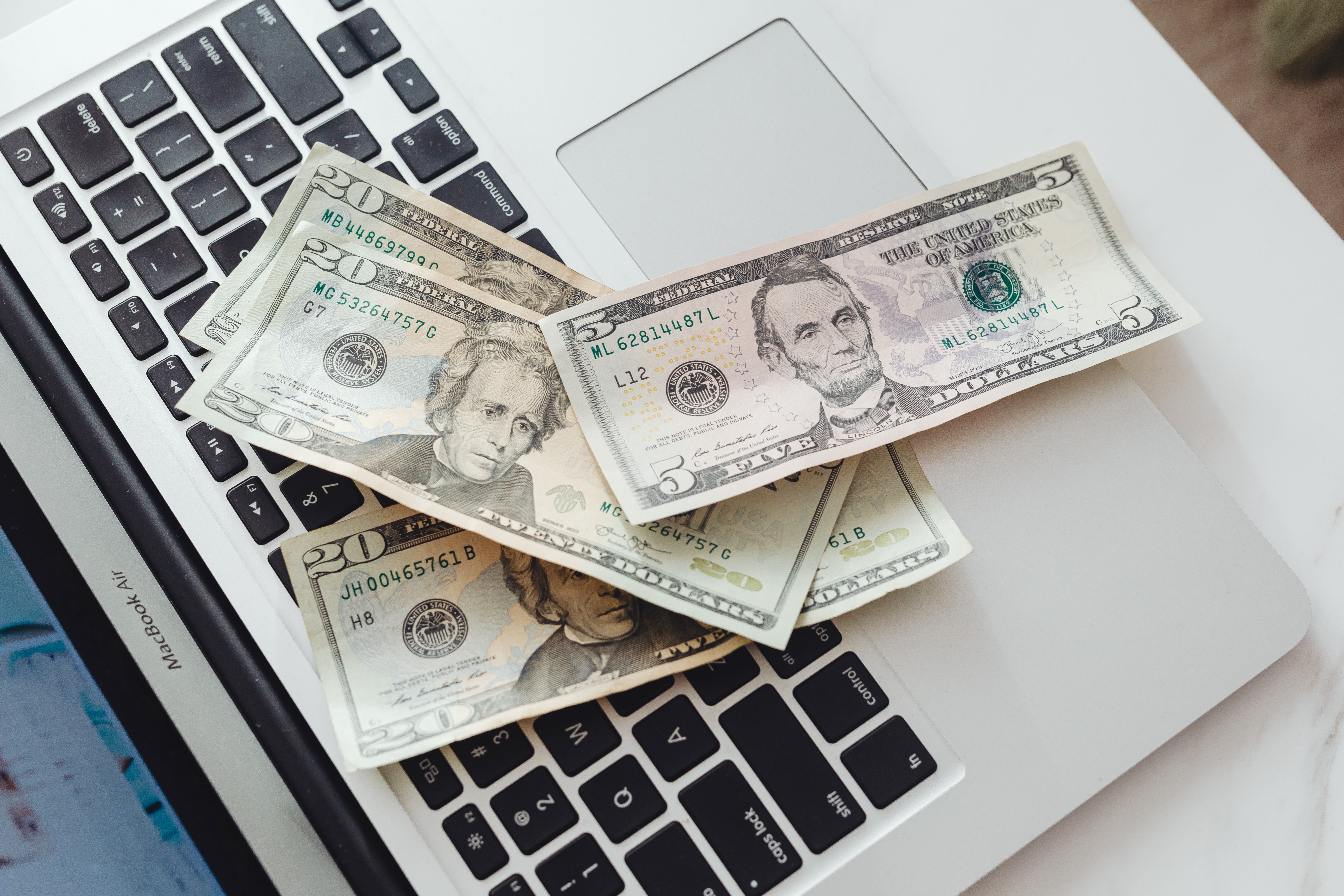 US Dollars On Laptop