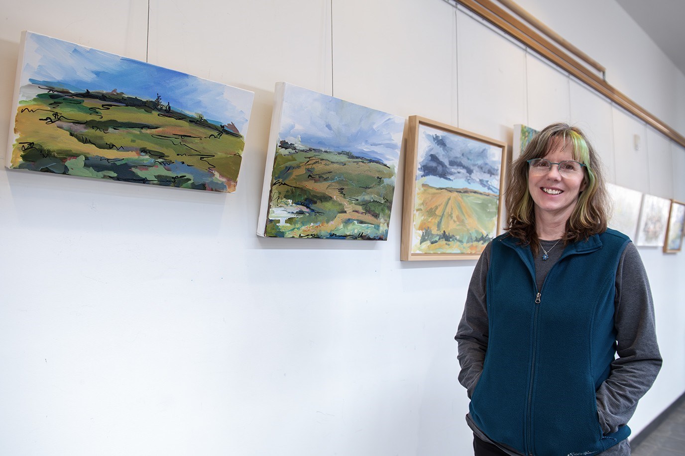 J Lomas in front of her artwork