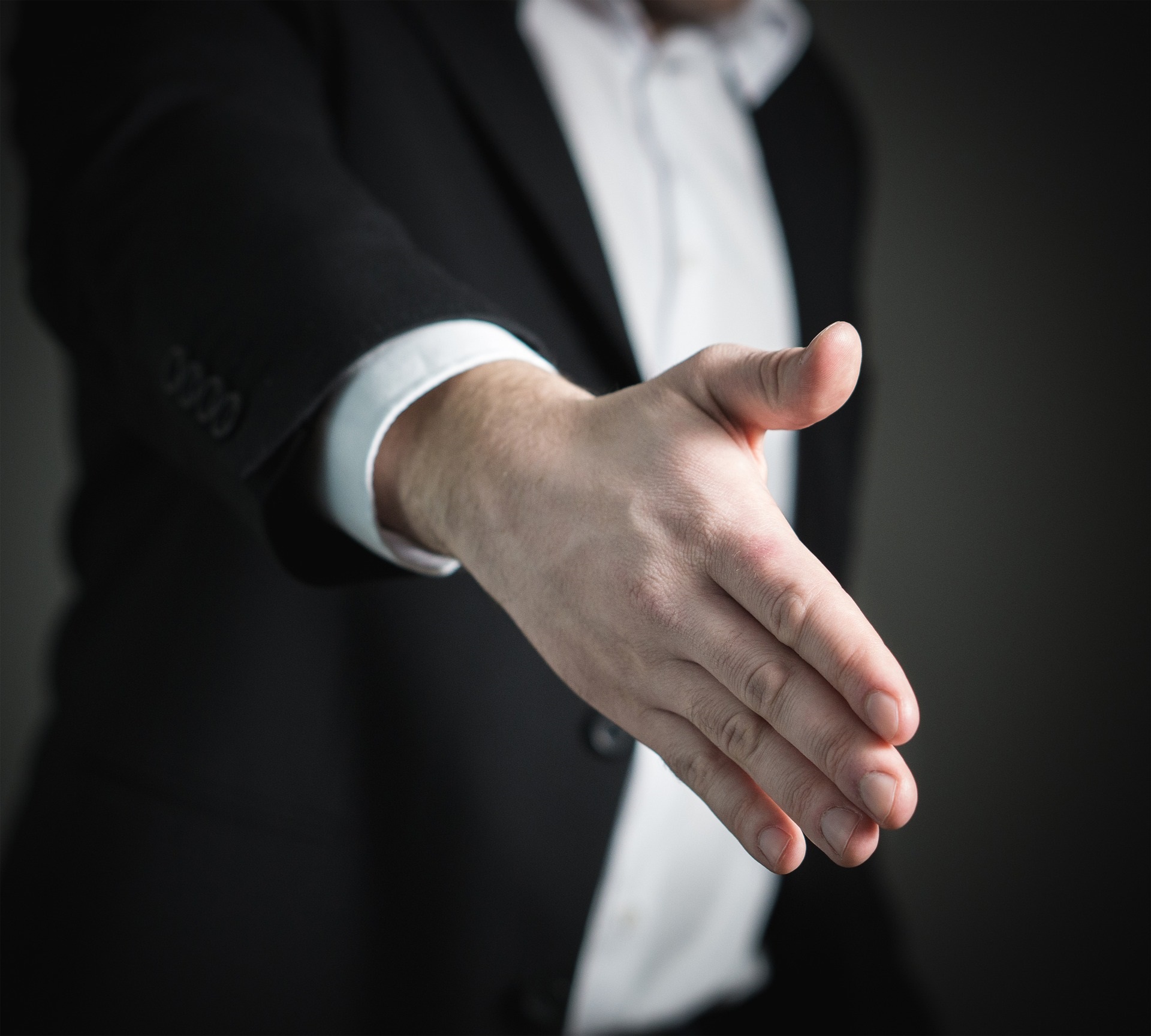 Arm extended for a handshake. 