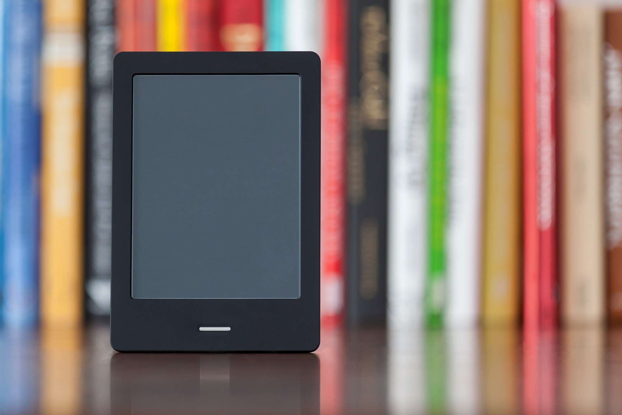 A tablet in front of a book shelf