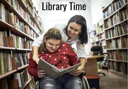 two people reading a book in the library
