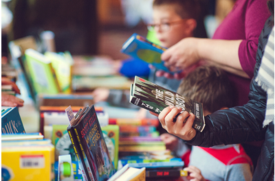 Family Shopping a Library Book Sale