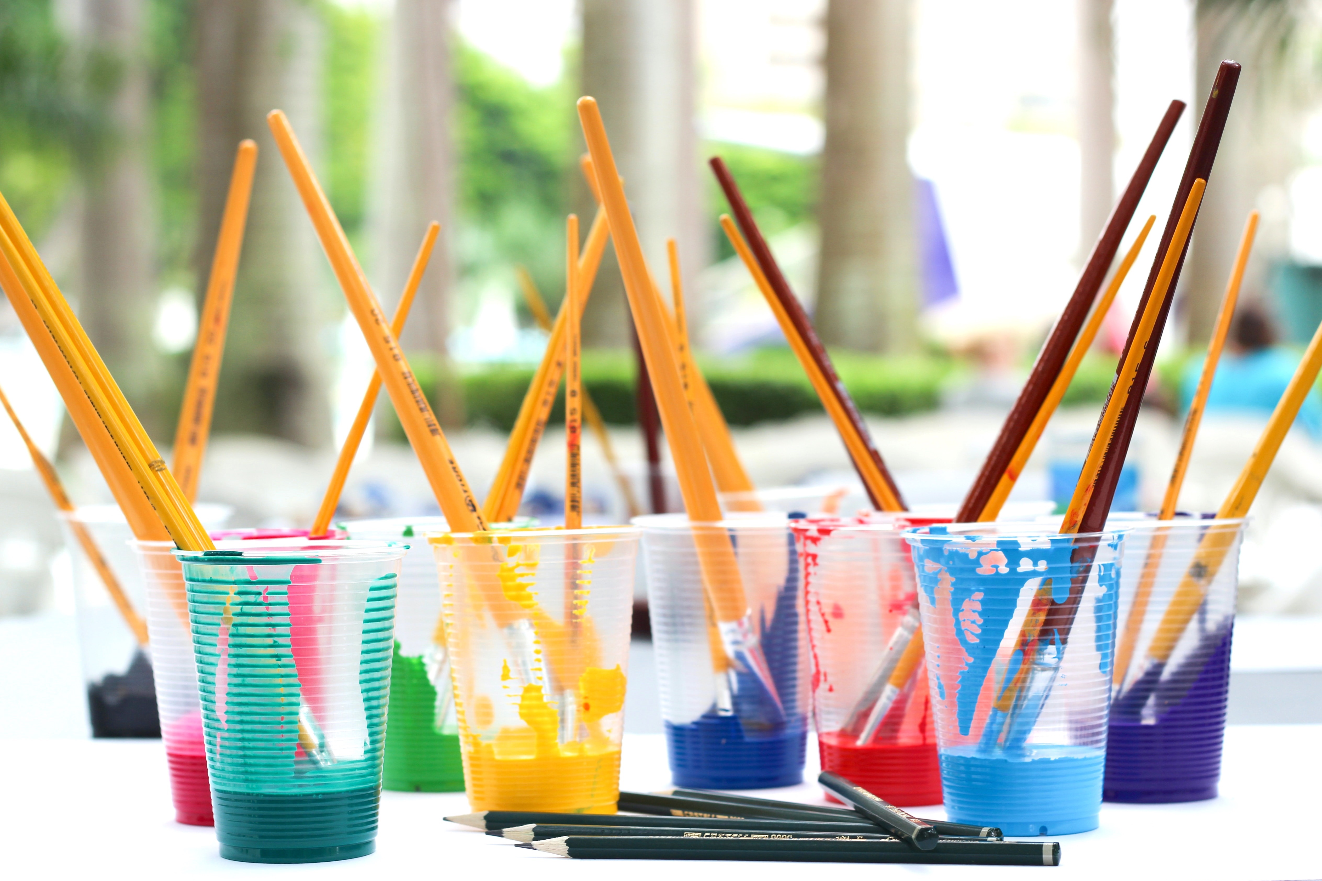 Paint Brushes in Cups of Paint