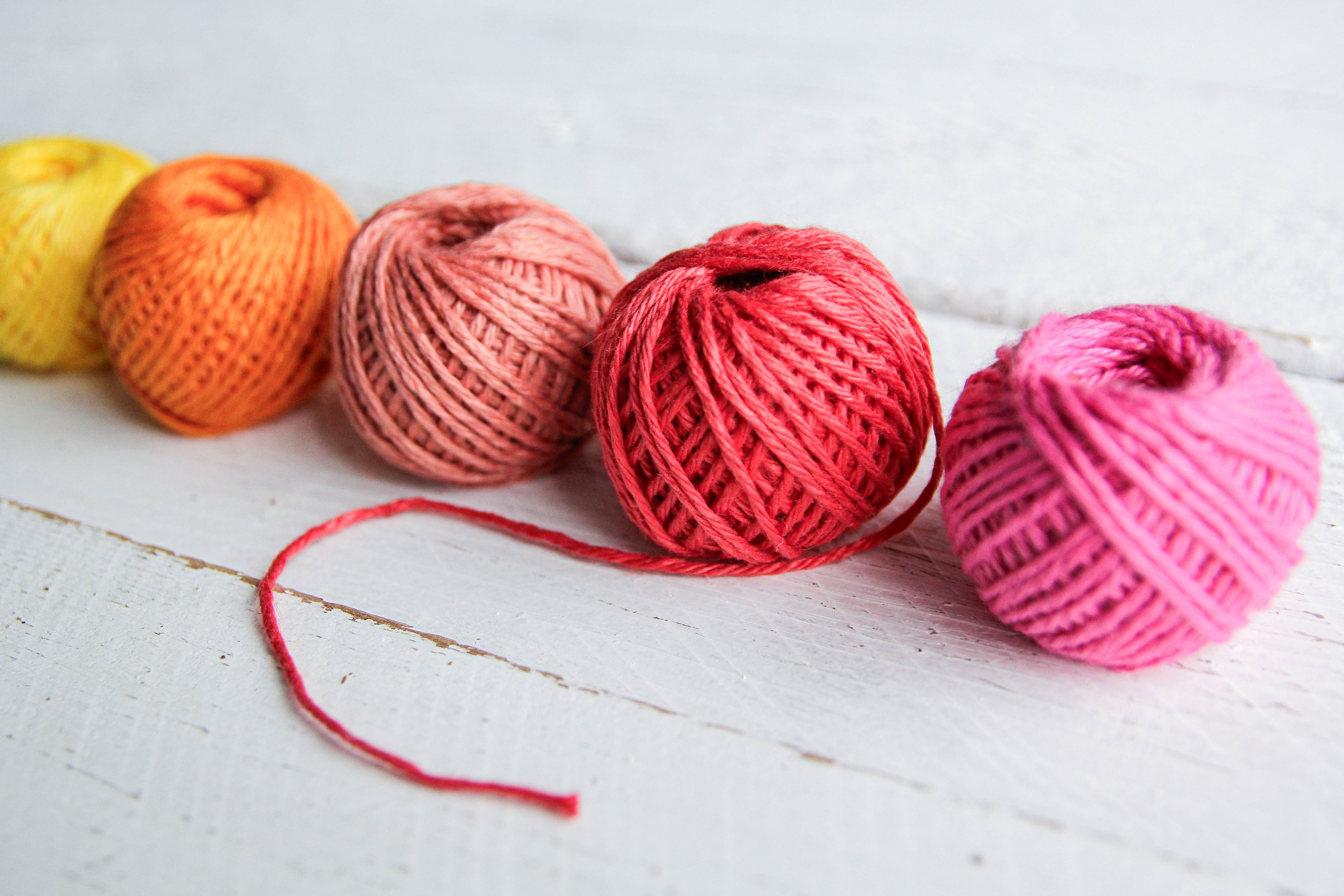 Colorful Threads on the Wooden Floor