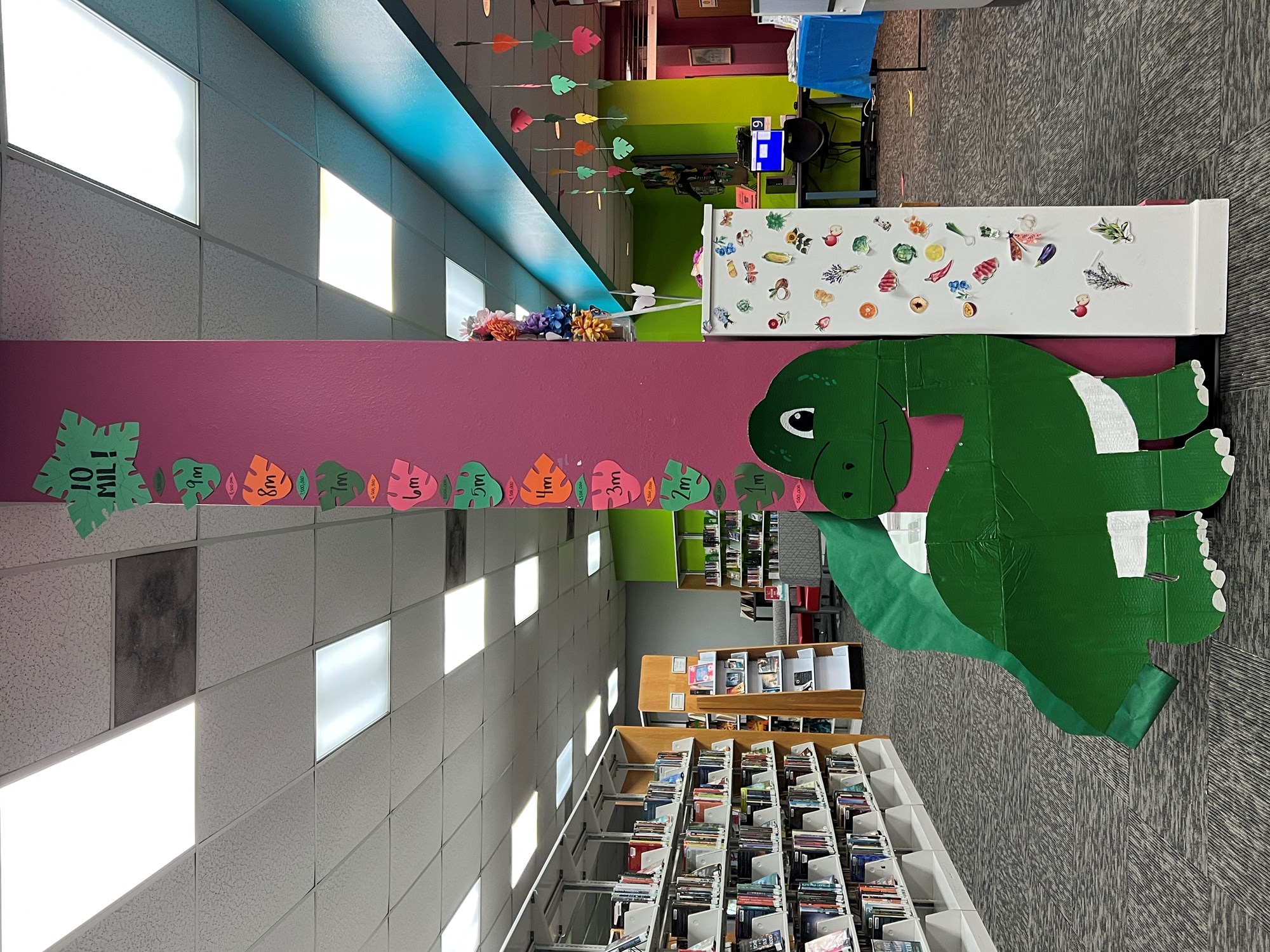 Freeport Branch Summer Reading Challenge Dinosuar with leaves display for tracking reading minutes