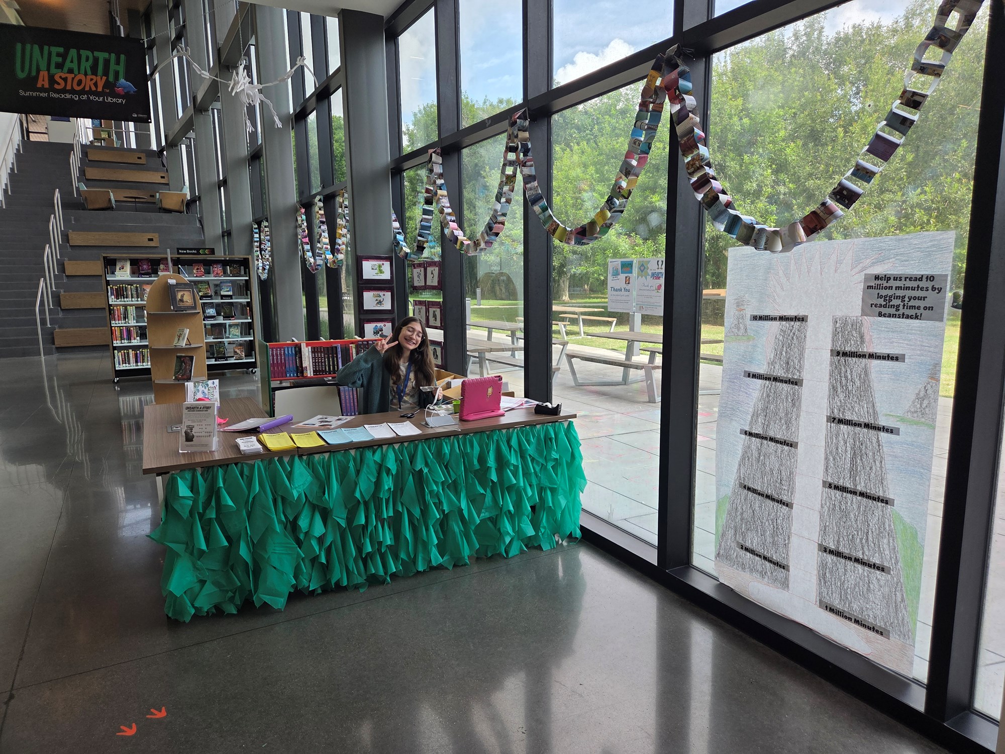 West Pearland Branch Summer Reading Display with Teen volunteer