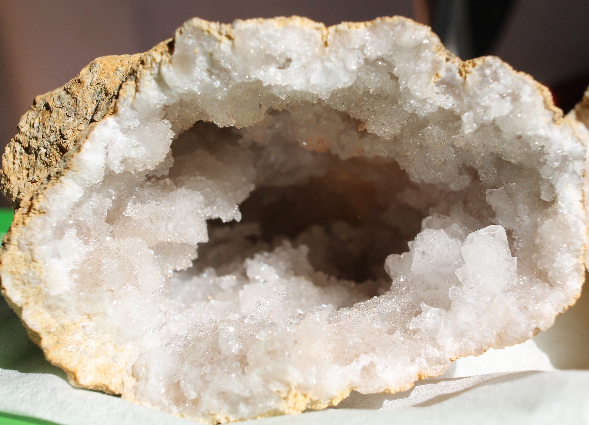 An opened geode with white crystals inside