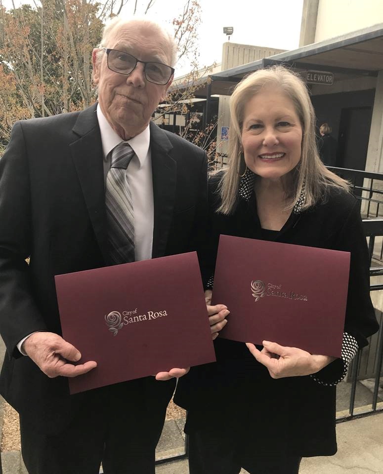 Sandy Frary and Ray Owen with certificates of appreciation