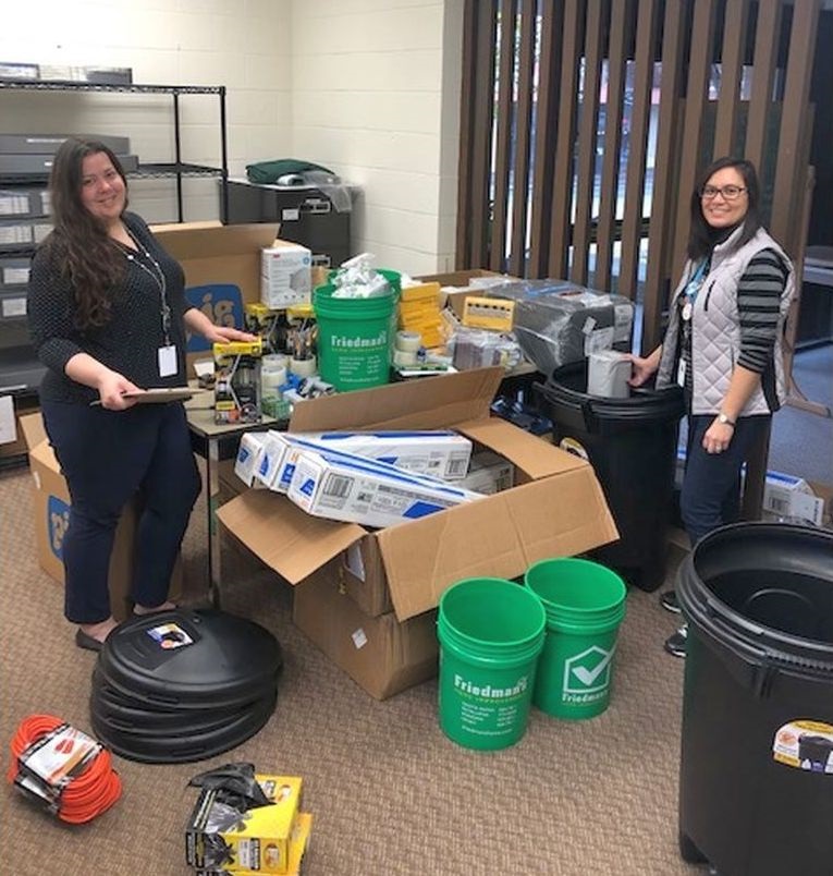 Special Collections librarian Joanna Kolosov (right) and Library specialist Elizabeth Fugere assembling the disaster response supply “cans.”
