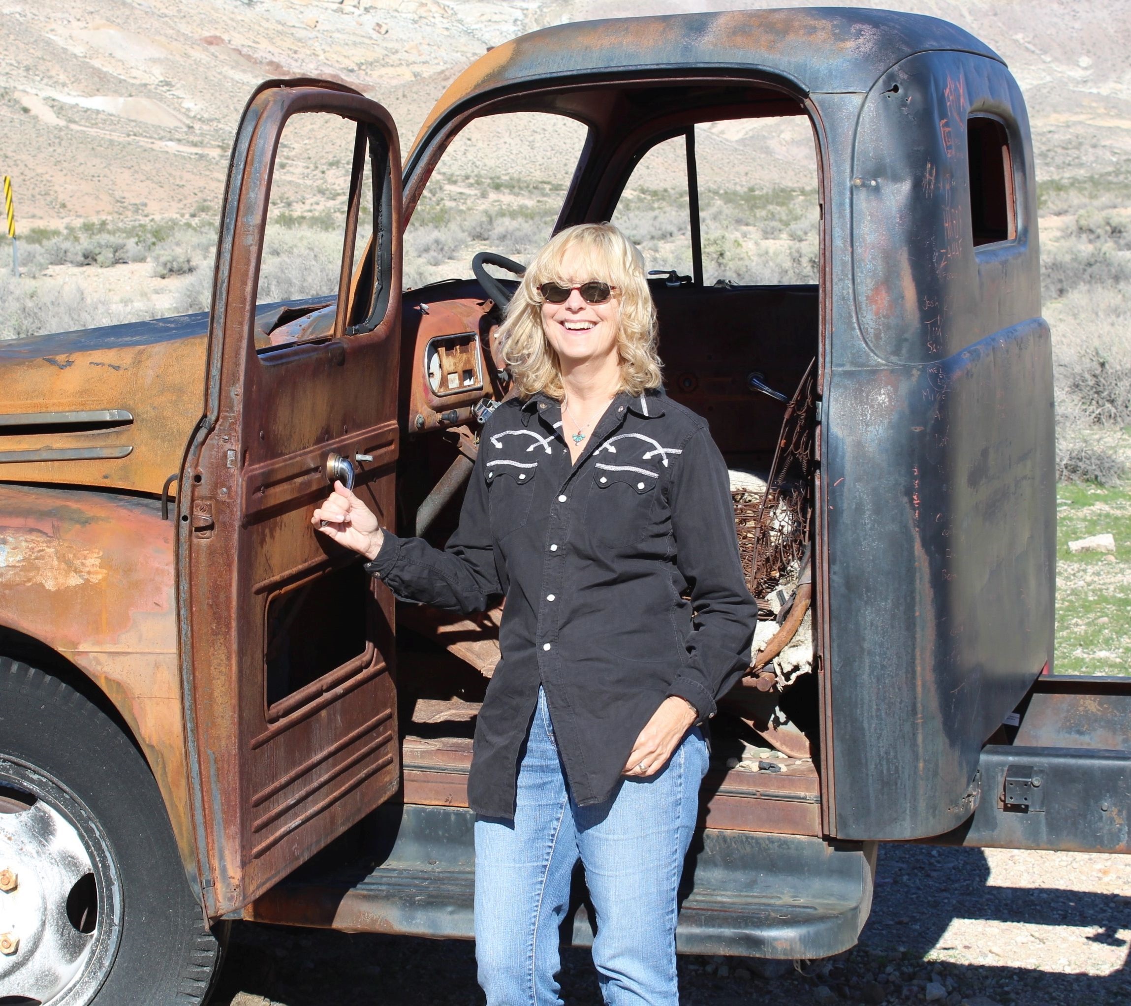 Local author and archivist Lynn Downey in front of a truck