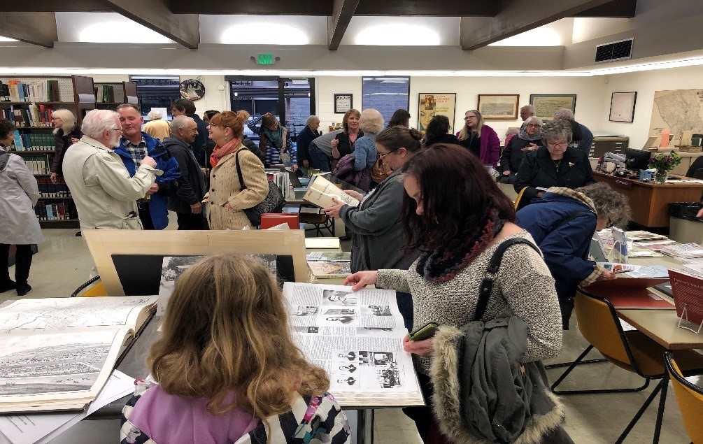 Visitors browsing materials during H&amp;G Library's Open Day event