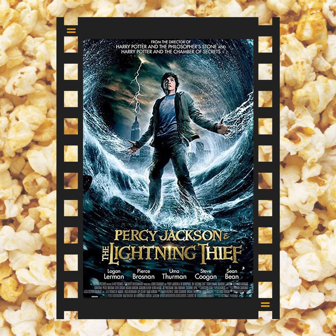 A piece of film reel with Percy Jackson & the Lightening Thief DVD cover and popcorn in the background.