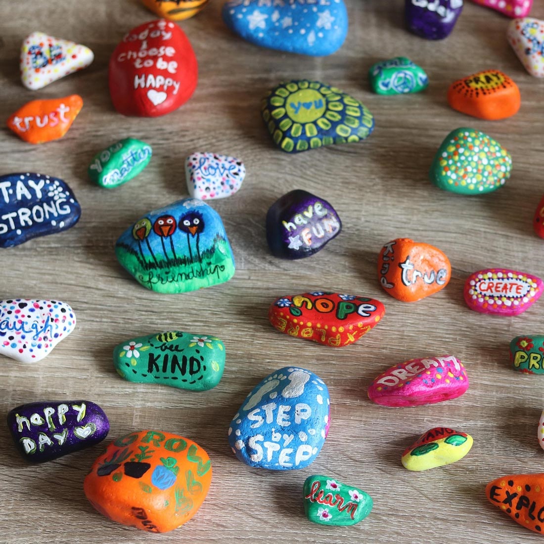 Adorable painted rocks with happy, inspiring messages.