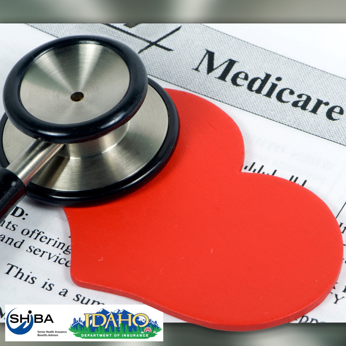 Image shows a red cut-out paper heart, and the listening end of a stethoscope laying on top of a medicare sign-up form.