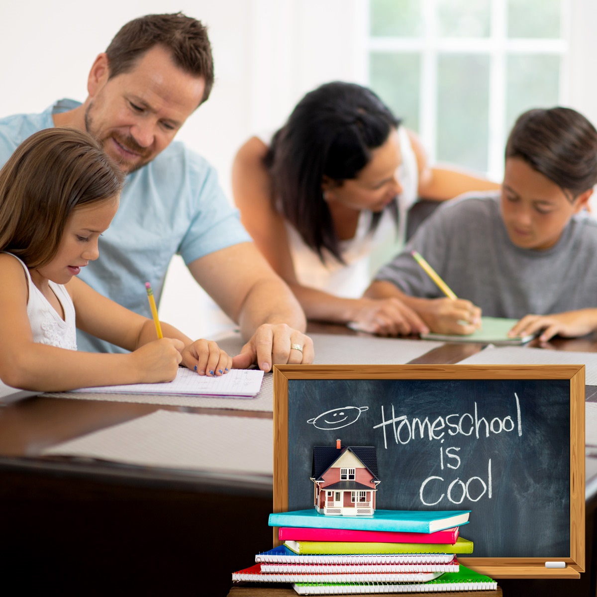 Image is a photo of 2 parents eaching helping a child with homework at a table.  In the foreground is a picture of  chalkboard that reads, "homeschool is cool."