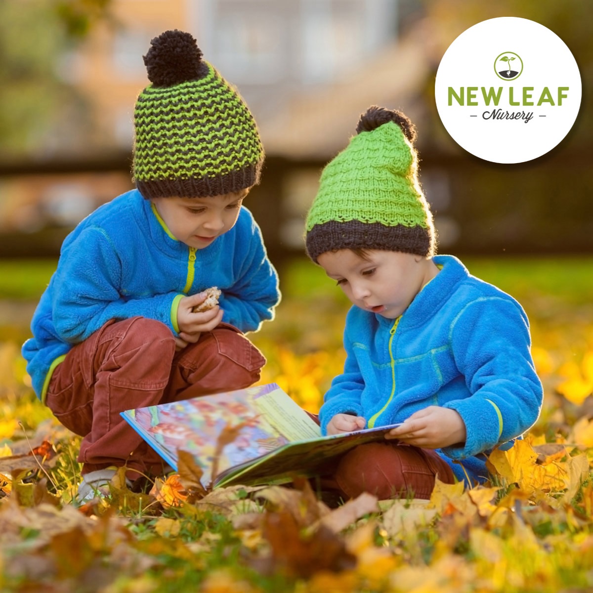 Kids reading in a backyard covered in fall leaves
