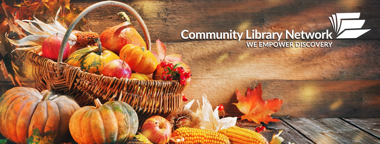 Our Community Library Network logo overlaying image of a huge basket full of goards, squash, apples, corn, and pumpkins.