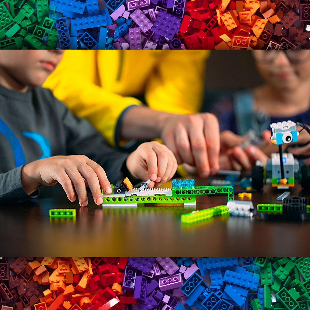 kids building with Lego pieces