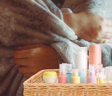 teen-wrapped-in-a-blanket-and-a-care-kit-in-a-wicker-basket