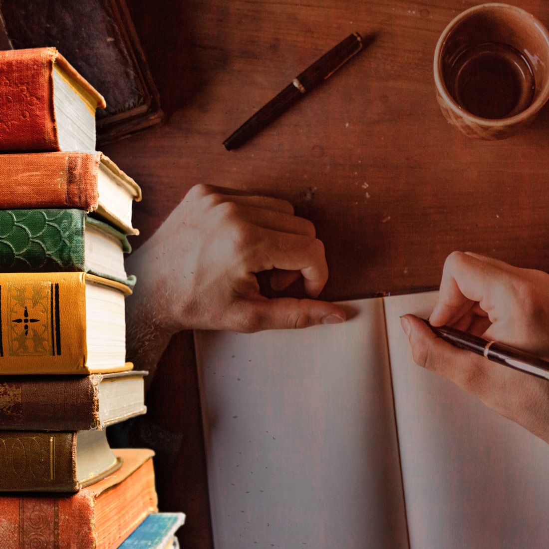 A stack of books in the foreground with a background showing an author writing in a notebook on a table with a cup of coffee.