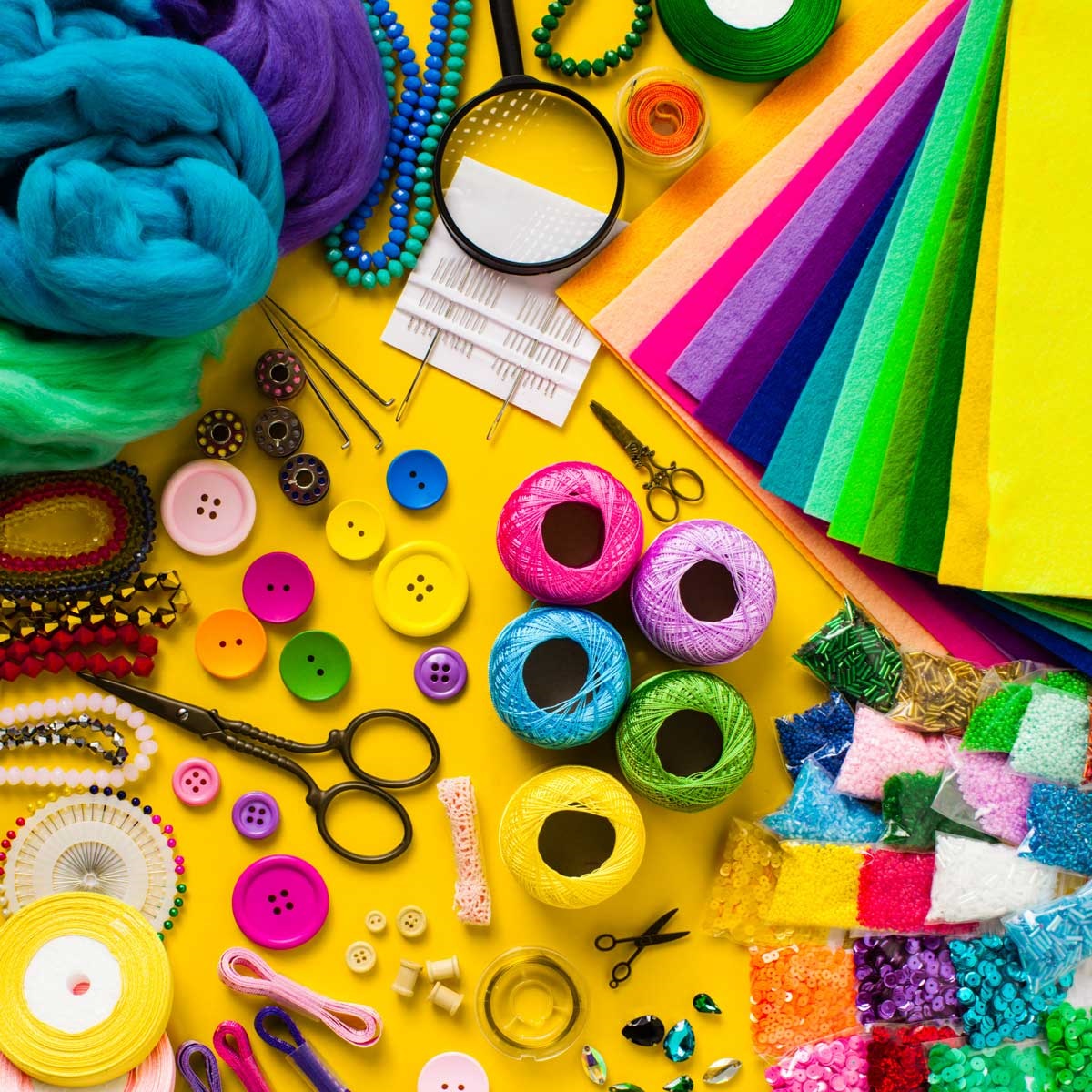 Colorful craft supplies laid out on the table.