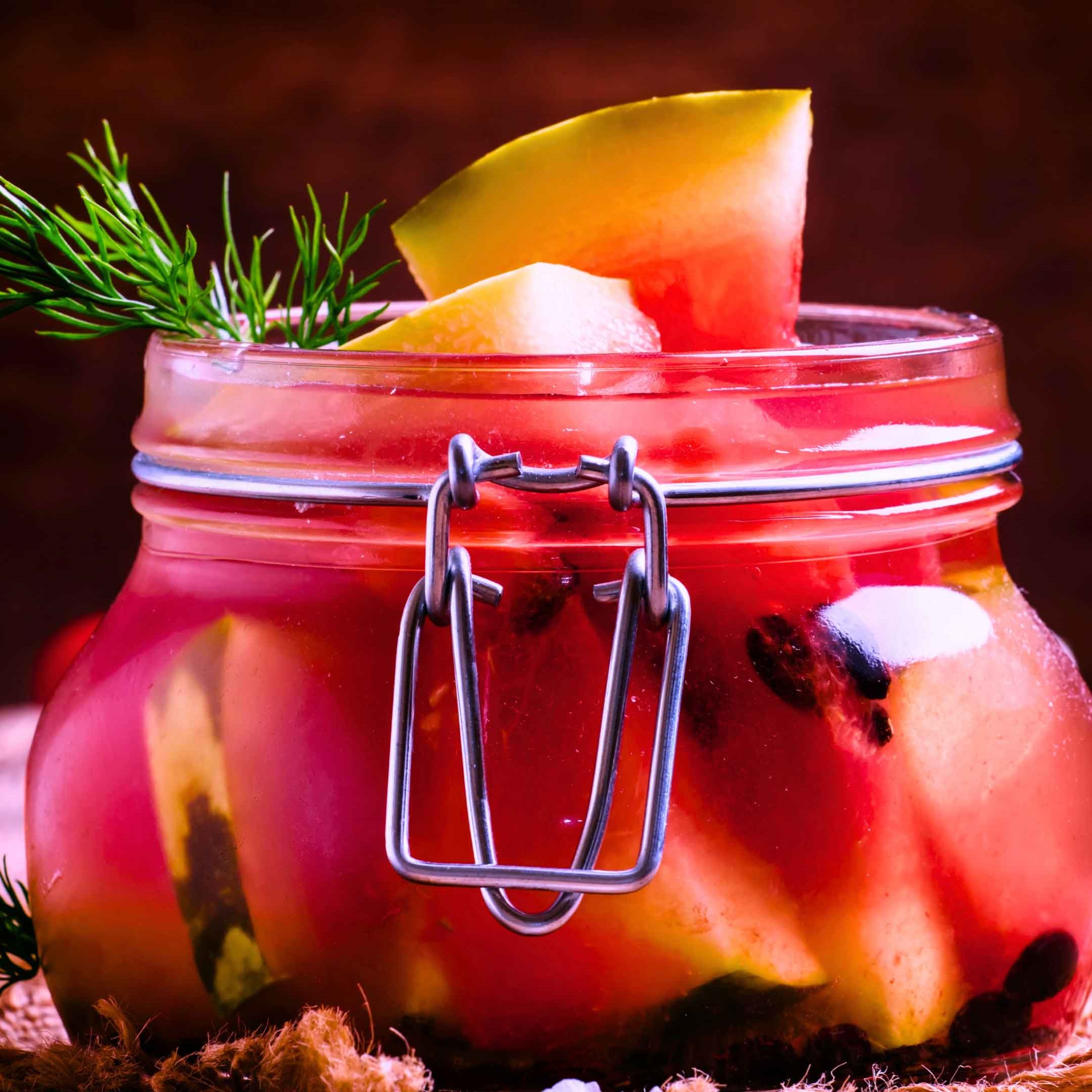 A jar full of pickled watermelon.