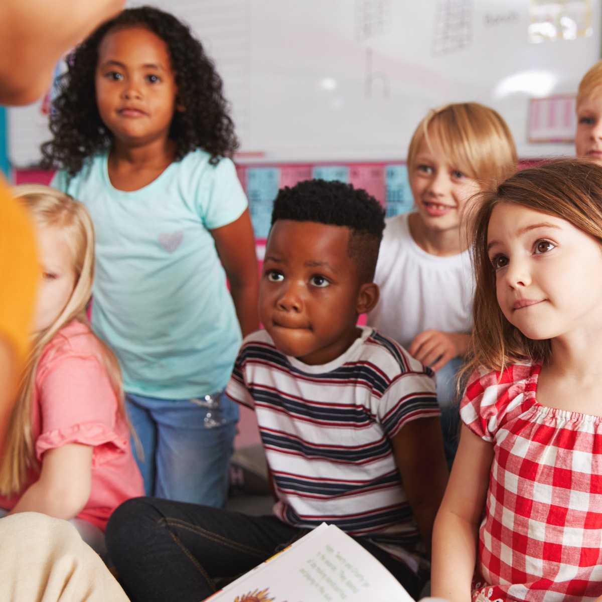 Children sitting and listening to a story.