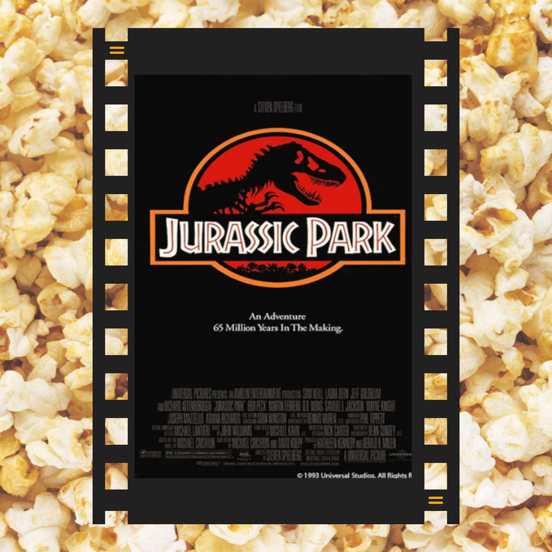 A piece of film reel with the Jurassic Park DVD cover and popcorn in the background.