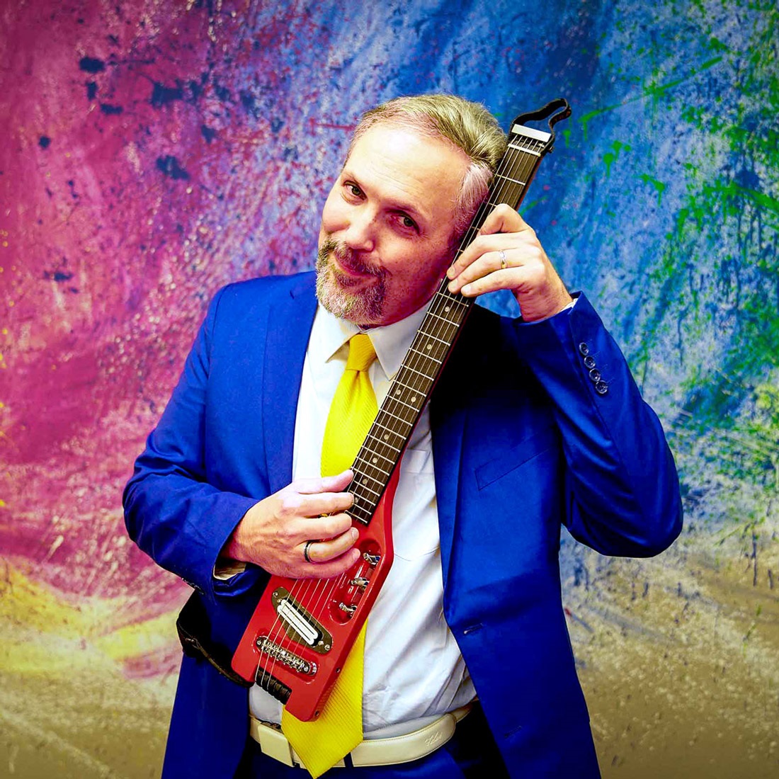 Eric Herman holding a guitar. Link to external site opens in a new tab or window.