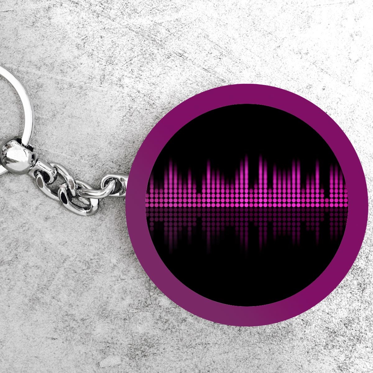 Keychain with sound waves on it.