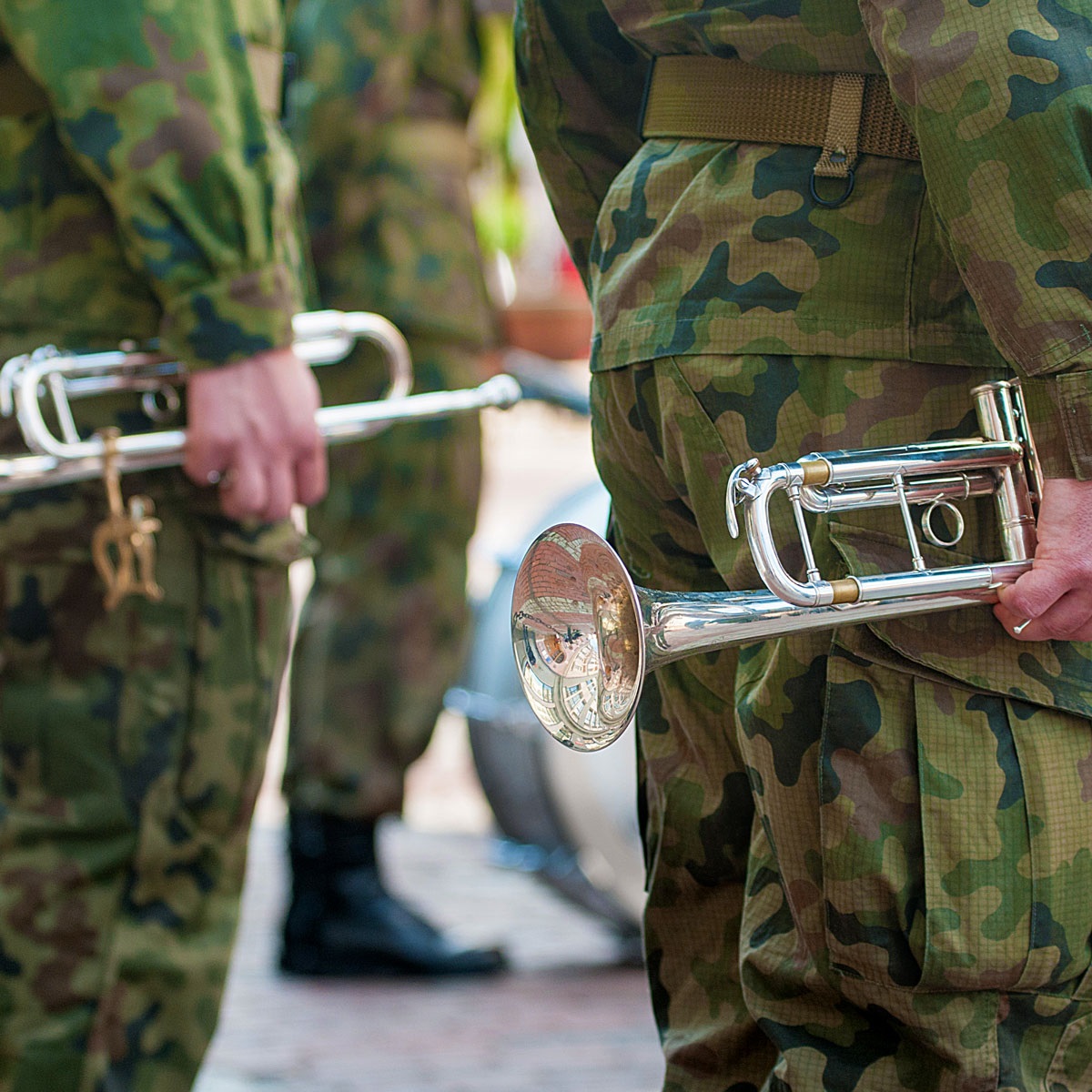 People in Army fatigues with musical instruments