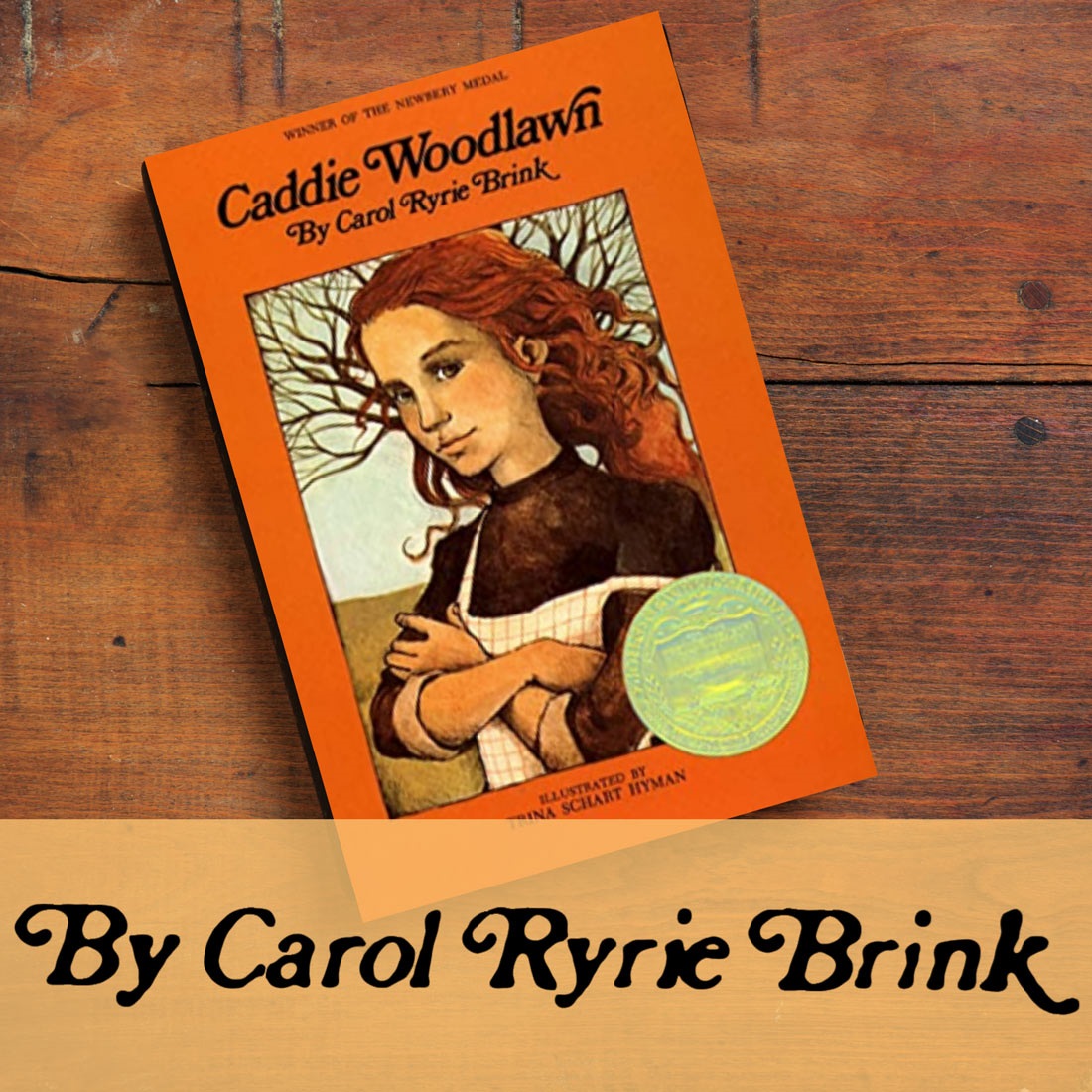 The Newberry award winning book, Caddie Woodlawn, written by Carol Ryrie Brink, laying on a table.