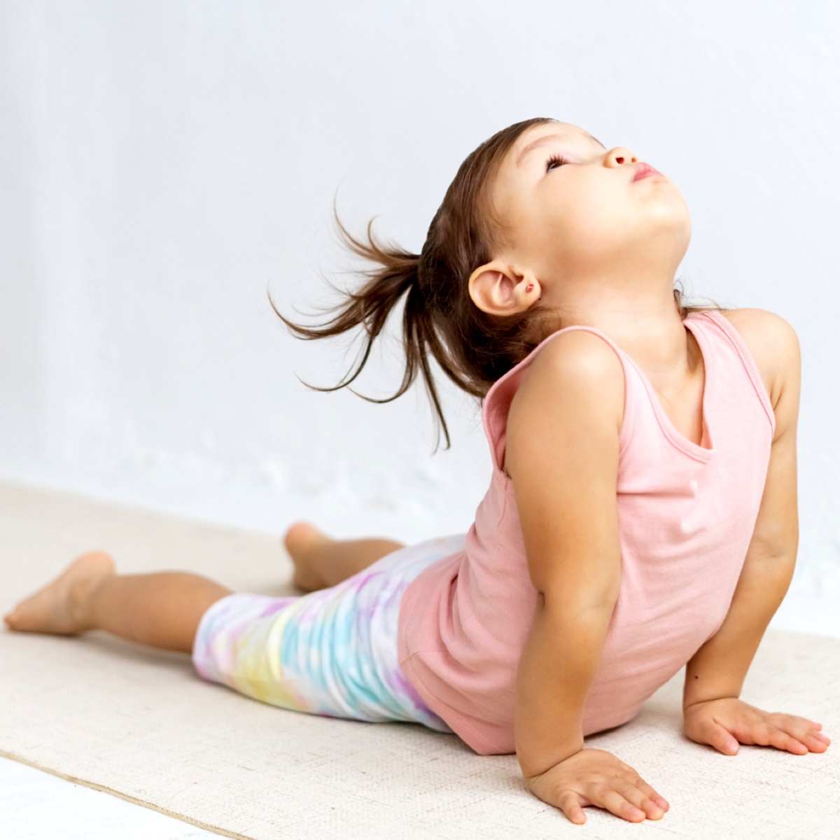 Toddler doing yoga.